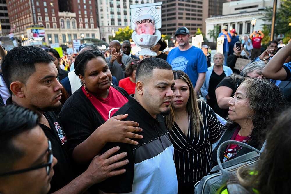 Salvadoran migrant and US resident Kilmar Abrego Garcia walks with his wife Jennifer Vasquez as he arrives at a US Immigration and Customs Enforcement (ICE) field office in Baltimore, Maryland, on August 25, 2025. (Photo by ROBERTO SCHMIDT / AFP)