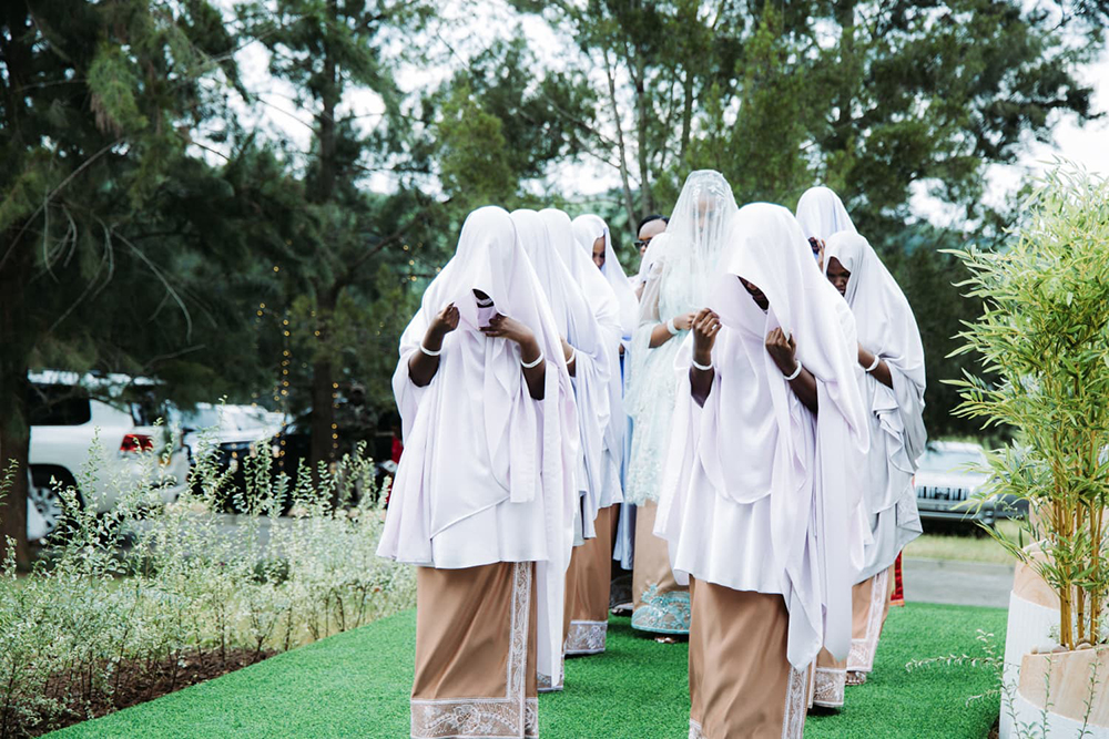 Here comes Nsasiirwe (centre), the bride.