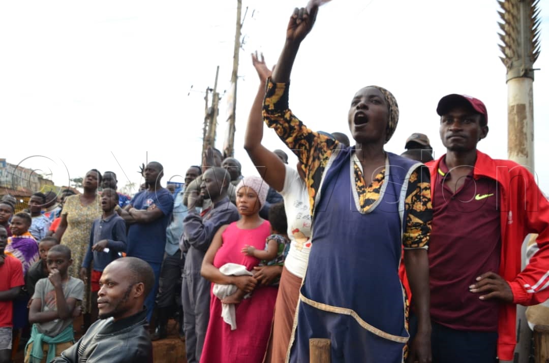 People cheering on Muntu at his campaign rally.