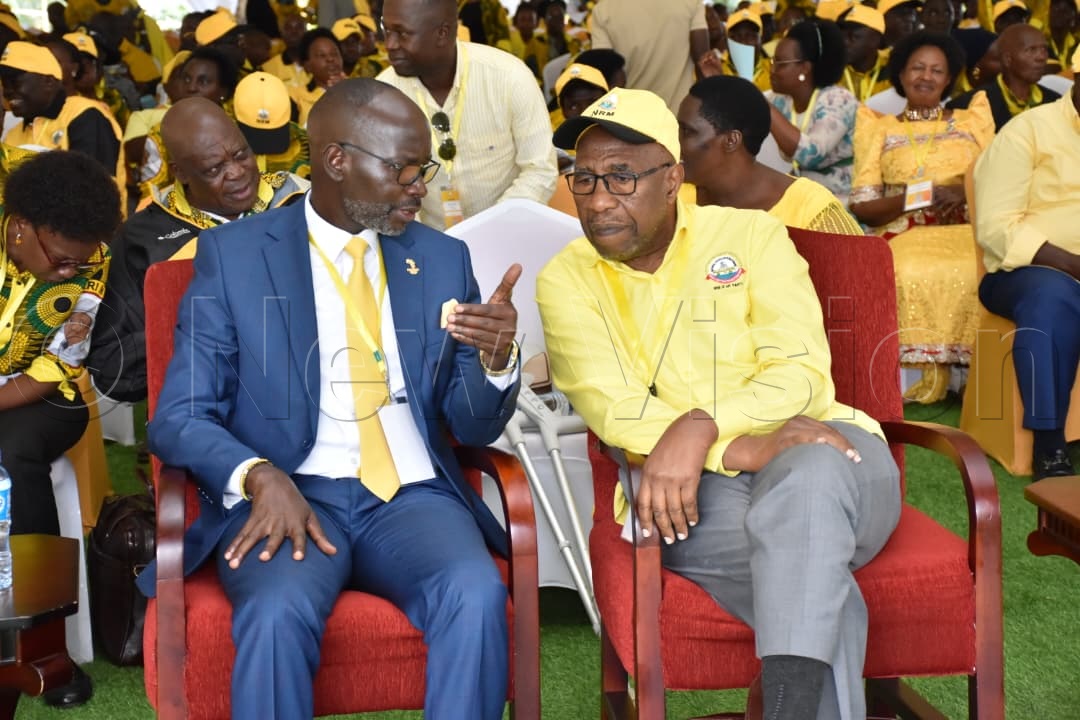 Obua and Rugunda sharing a light moment.