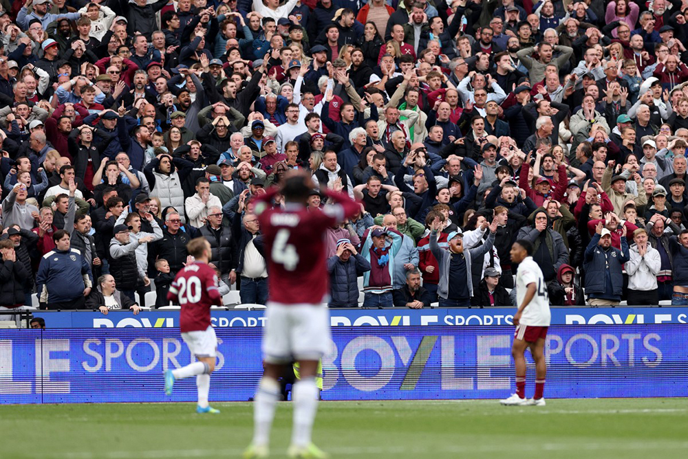 West Ham fans react to a missed shot during the English Premier League football match between West Ham United and Arsenal at the London Stadium, in east London on May 10, 2026. 