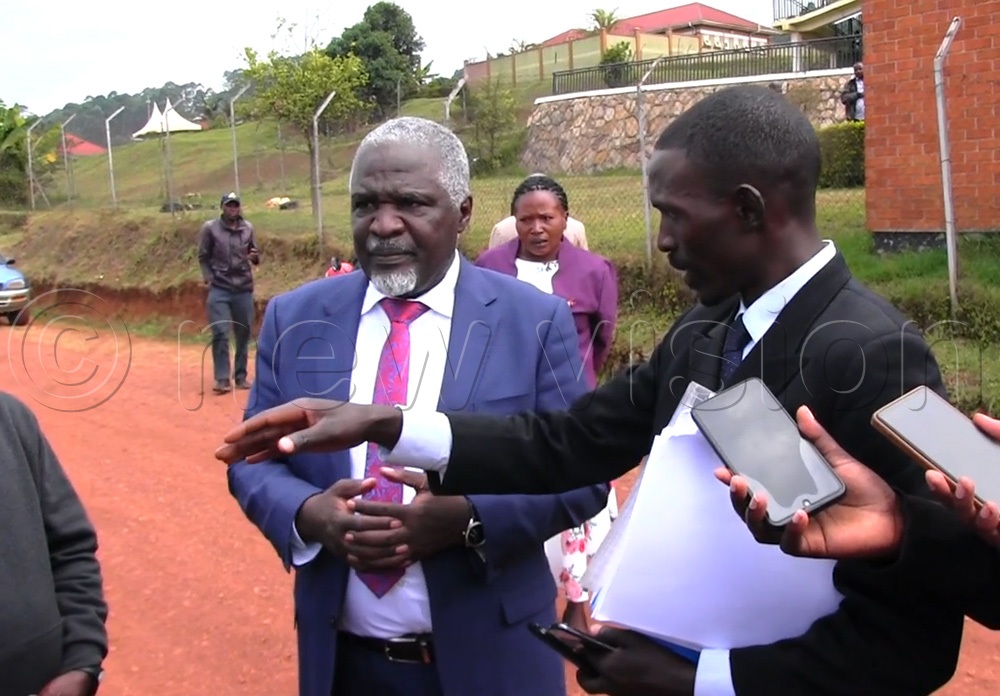 Eddie Kwizera Wagahungu, the Member of Parliament for Bukimbiri County speaking to the press after the hearing of the two petitions against his victory. (Photo by Nelson Ahimbisibwe)