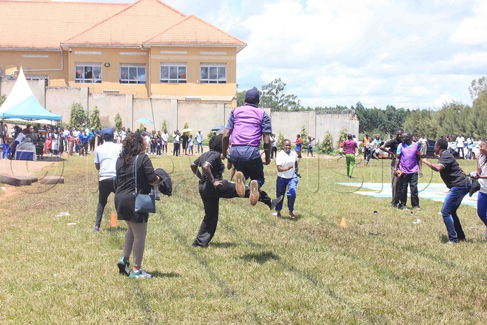 Teachers and parents cheer on their peers participating in the short relay competition during the Seeta High School A-Campus inter-house sports event. (Photo by Henry Nsubuga)